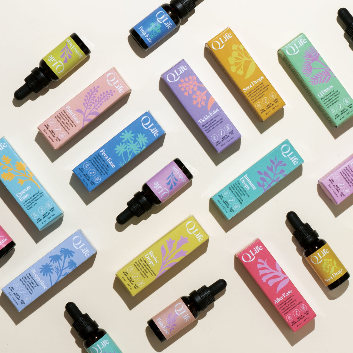 QLife herbal drops and boxes in colourful packaging, including Sleepytime, Immune Drops, Snot Drops, Tickle Ease, Feva Ease and Revive Drops